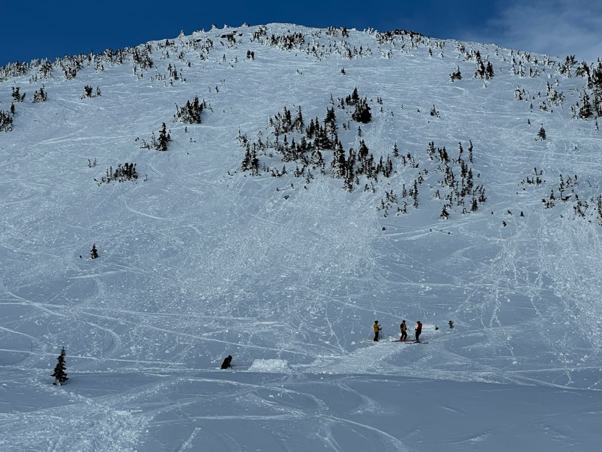 Filming under an avalanche prone slope on a warm sunny day... 