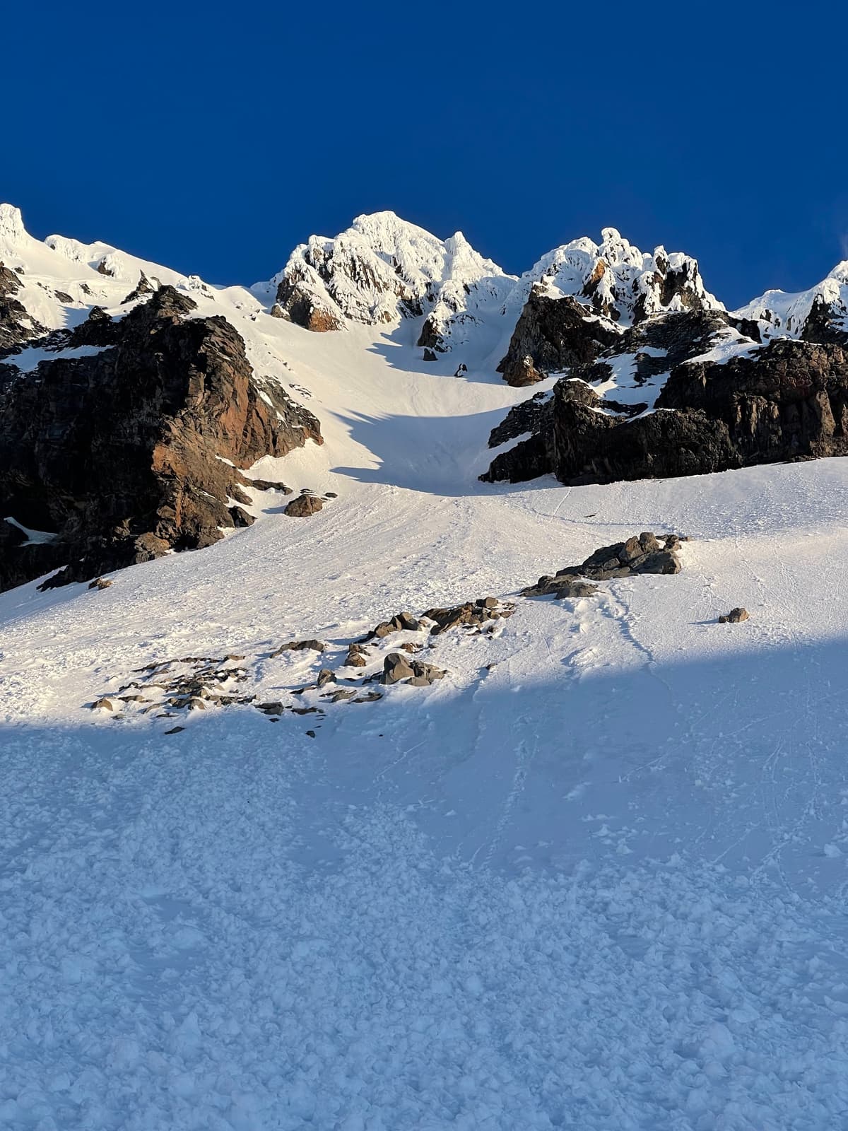 Atwell East Face. Starting the bootpack. Line is fairly central on the East face in an overall picture. Took the line in this photo that goes slightly up and lookers right through a dog leg. 