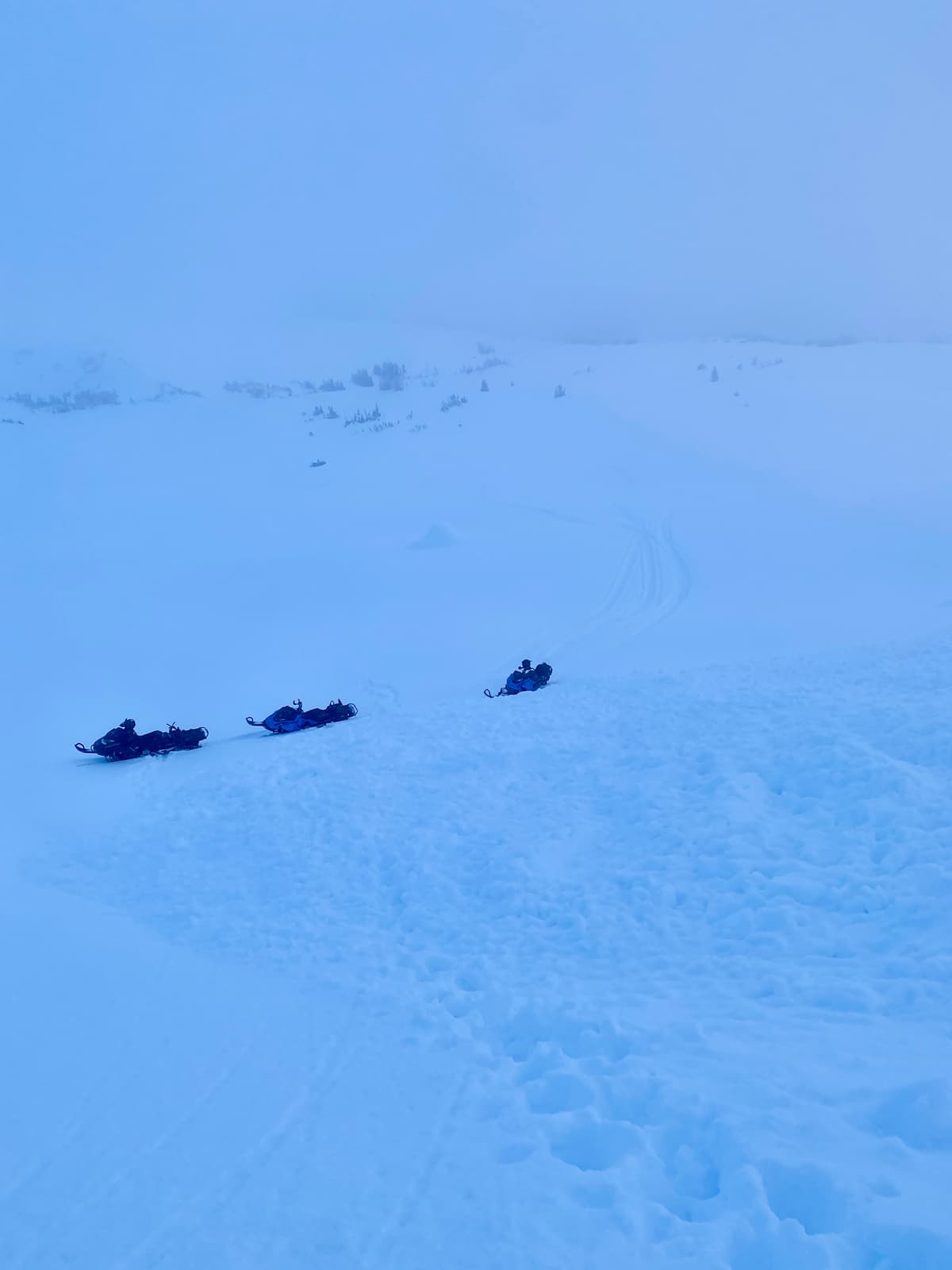 sleds parked at the bottom of the debris.