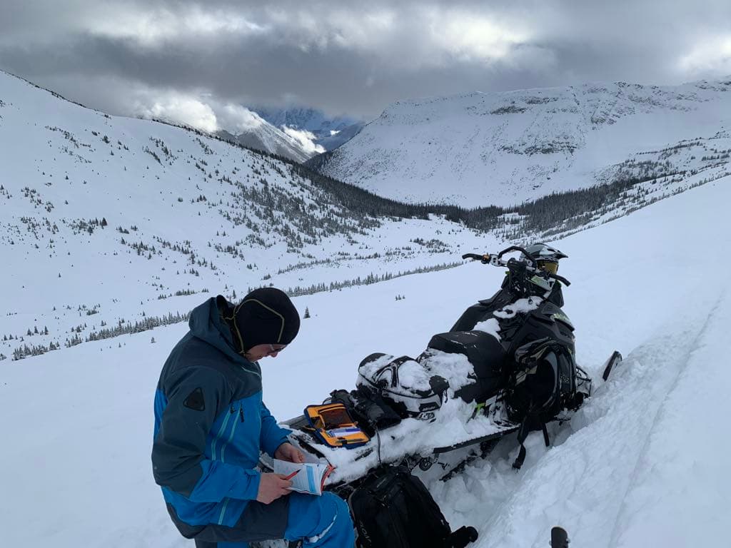 Recording the test pit observations above the main riding area