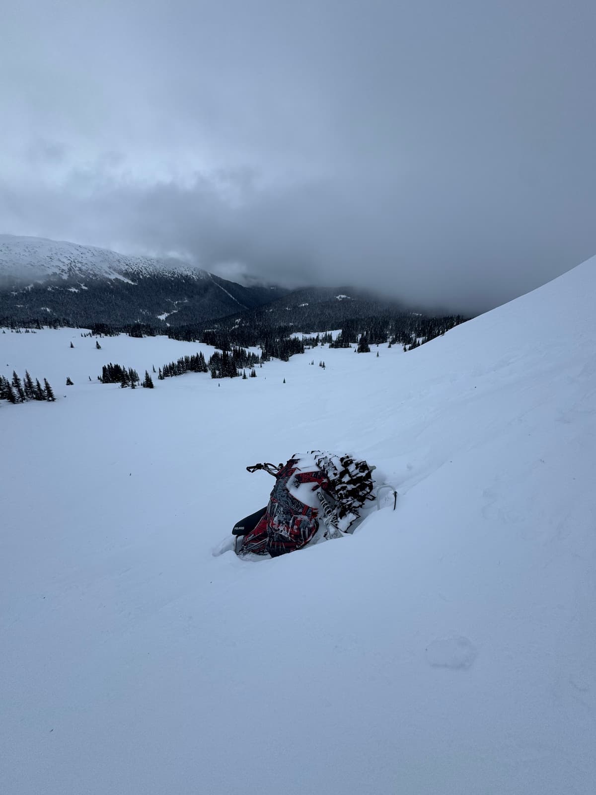 Found damaged snowmobile in debris