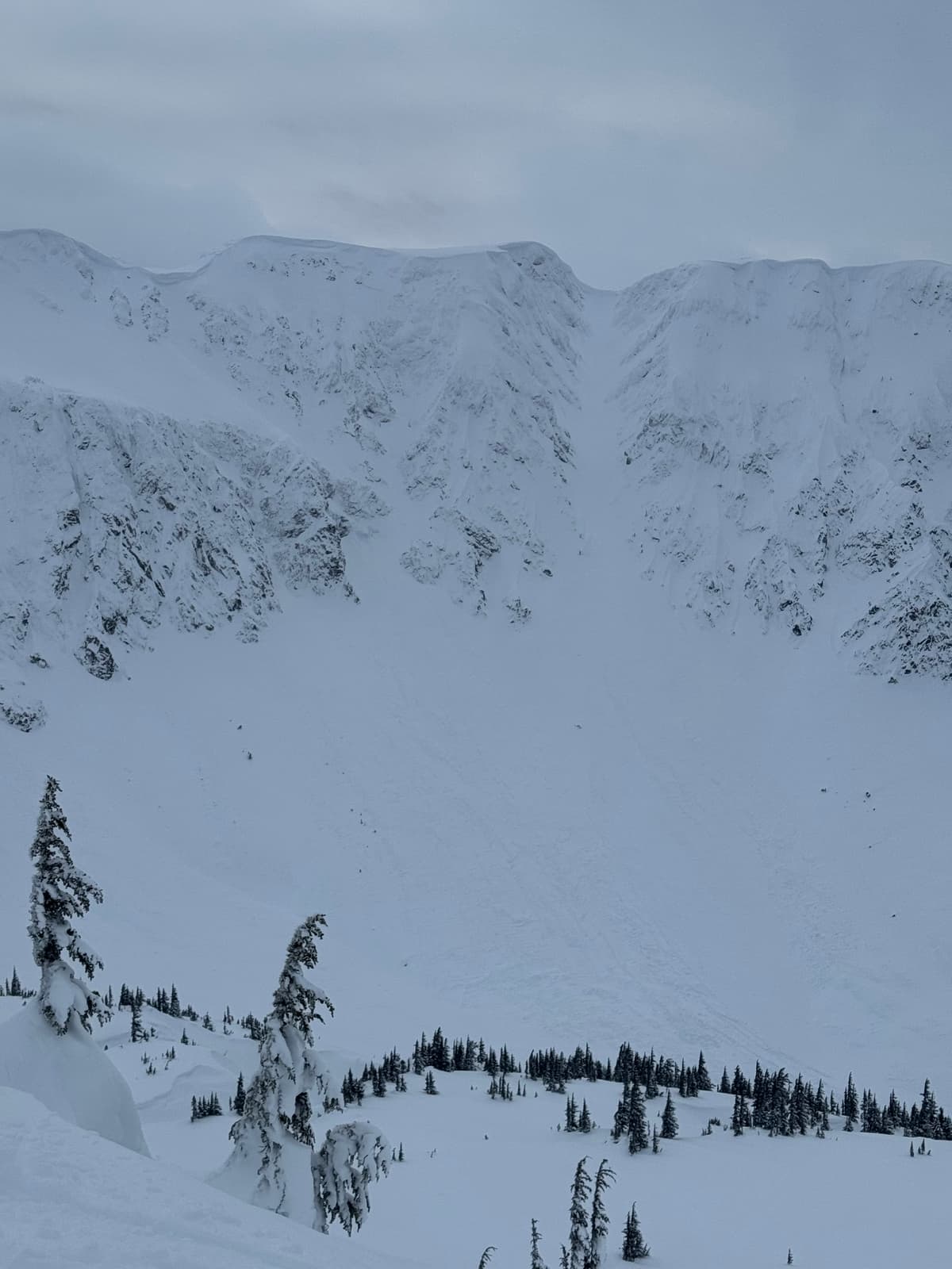 Debris from a large avalanche. Crown can be seen near ridge crest. 