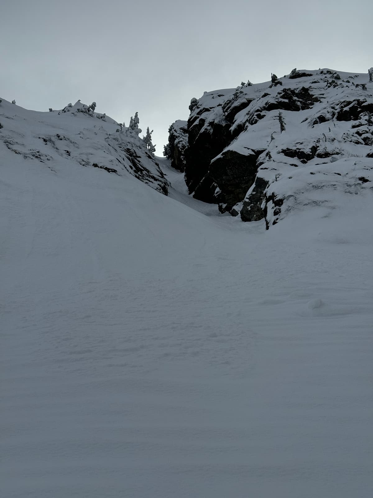 Previous loose dry slide debris covered in overnight snow