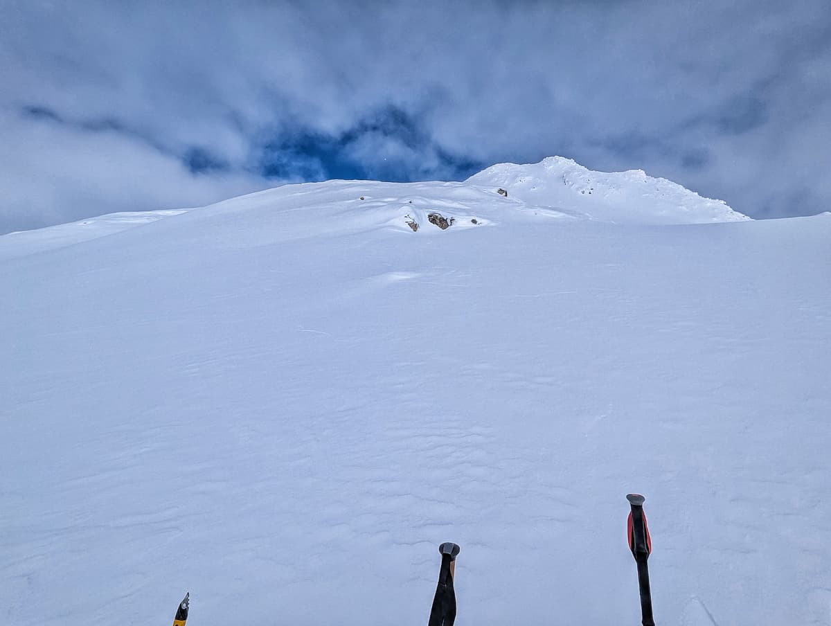 Visible cracks to the right and by the rocky outcrop, day's objective in the background