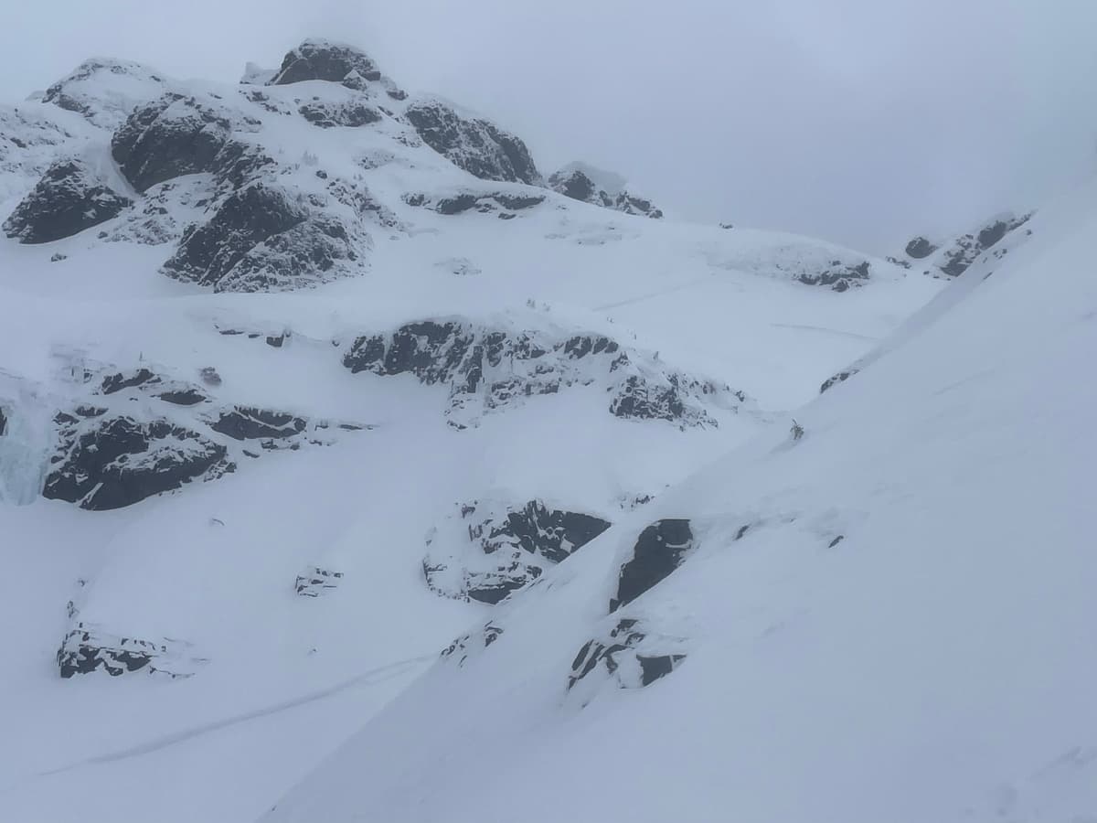 Cornice missing in the upper centre and the path of the avalanche it created