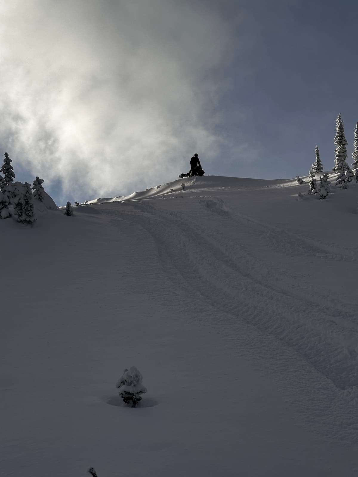 Snow was blowing along the ridges. 