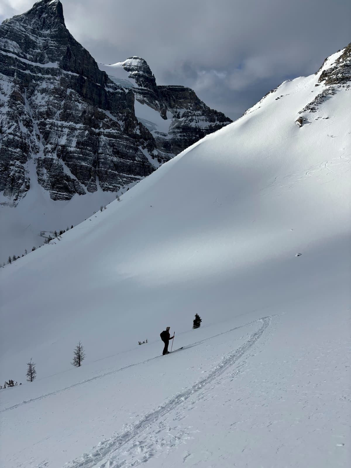 Skiing up behind Fairview Mountain for an extra run (you can see some previous tracks across the bowl)