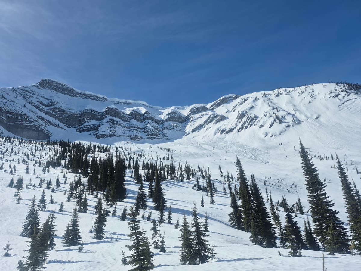 Large cornices at ridge top of Grizzly Peak, lots of sluff debris 