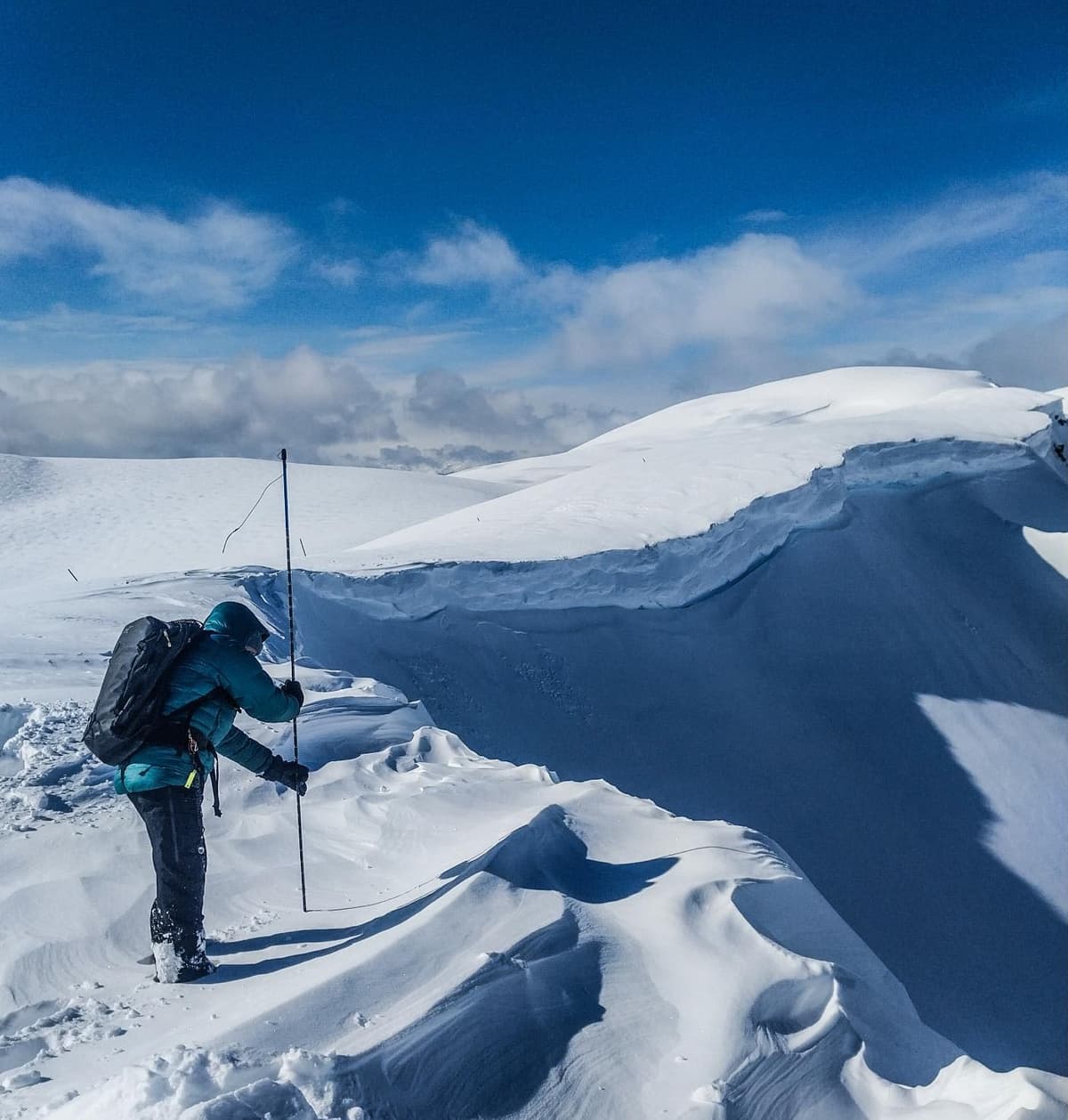 Pulled out the probe to check for cornices before approaching the edge. 