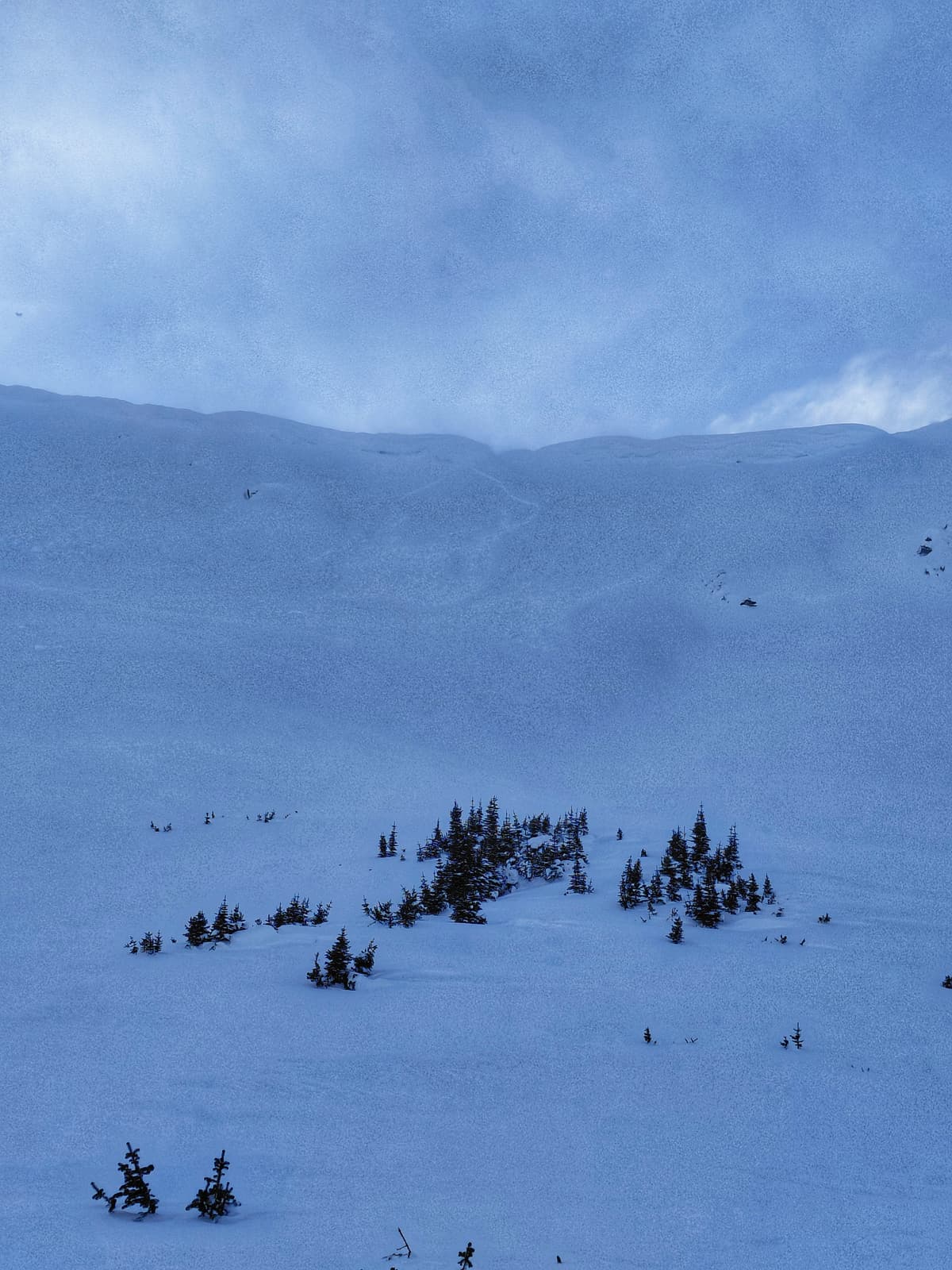 Recent wind slab and active blowing snow