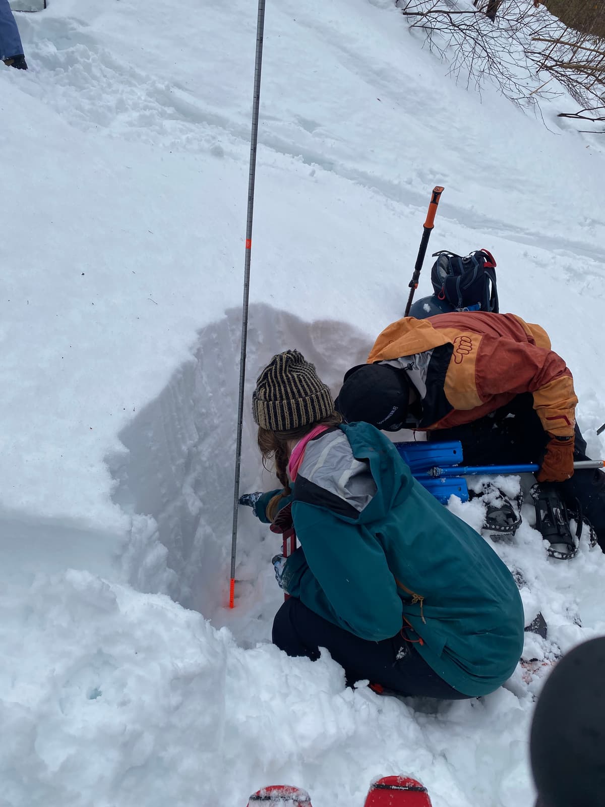 Digging a pit nearby to the avalanche debris field