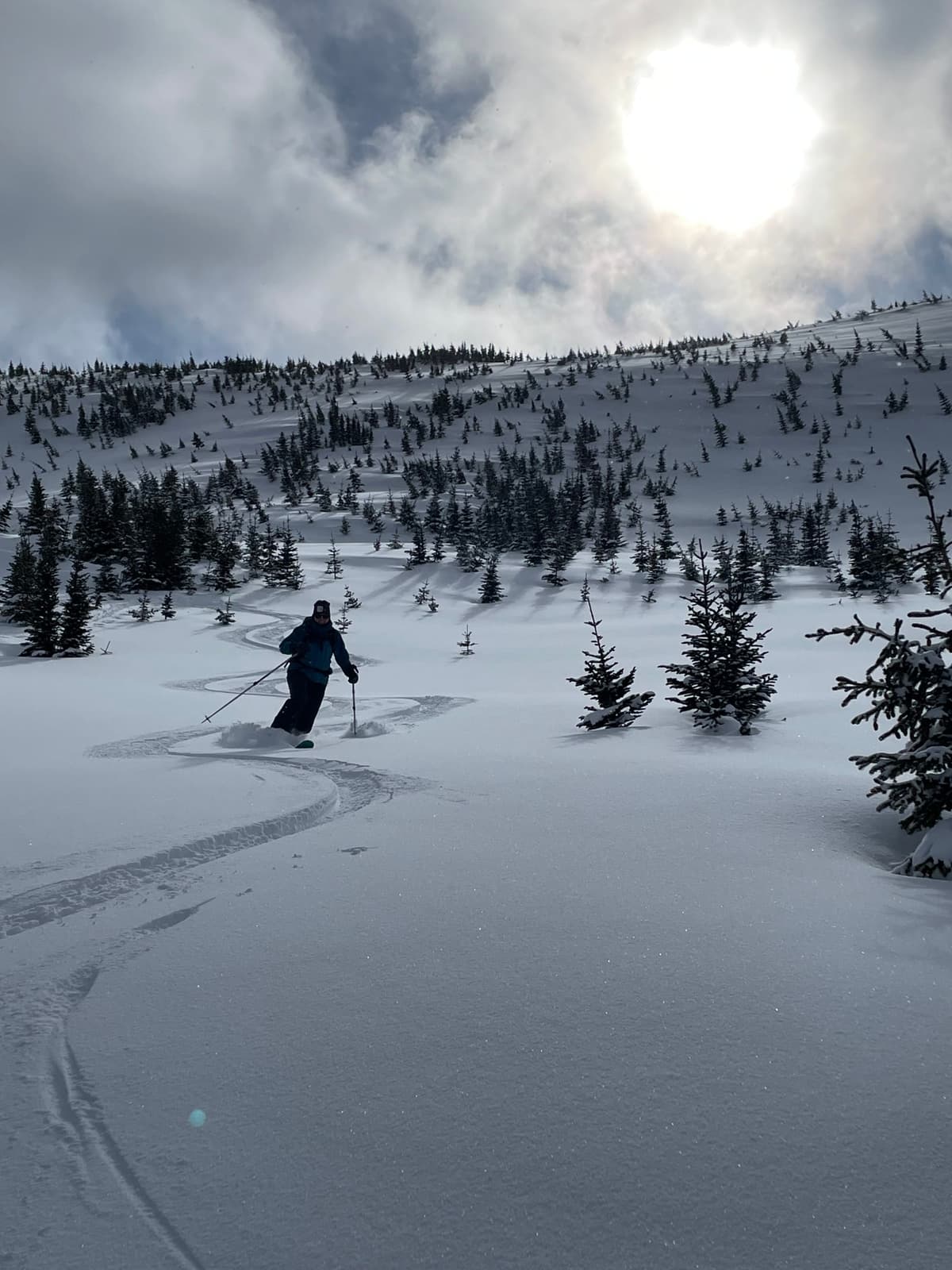Below ridge is wind affected but covered with new powder.