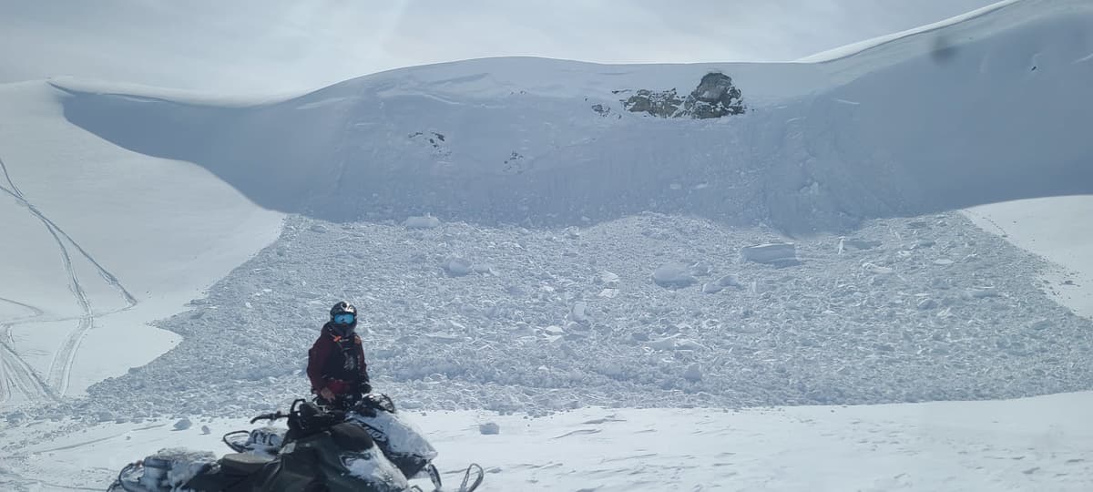 Notice our tracks lower left heading in about noon. Coming back out at 2pm this cornice drop covered part of our tracks. Chunks were over 2 meters high