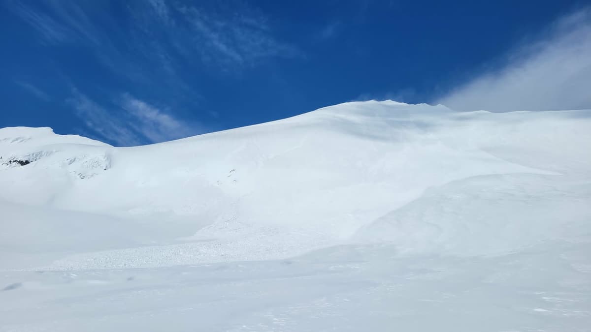 Near full face of south Two Sisters slide, wind affected